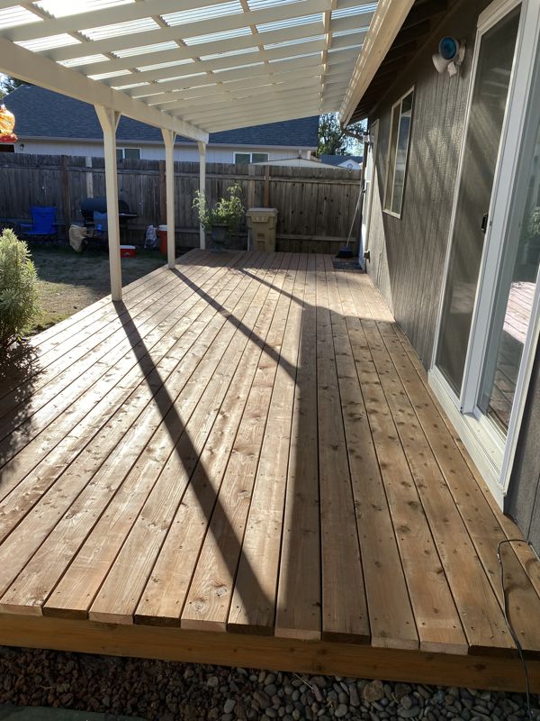 Finished cedar deck under a covered patio roof